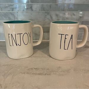 Rae Dunn Enjoy Tea white mugs with black print / teal inside.